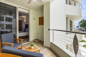 Chic Coastal Condo With Private Balcony, Pool Access & Steps to the Be