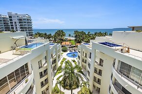 Chic Coastal Condo With Private Balcony, Pool Access & Steps to the Be