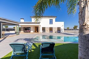 Palm Breeze Villa by Fidalsa