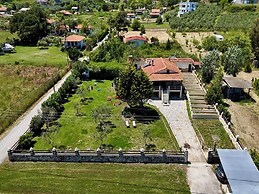 Spacious Beachfront Retreat With Large Garden in Ormos Panagias