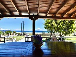 Spacious Beachfront Retreat With Large Garden in Ormos Panagias
