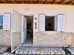 Spacious Beachfront Retreat With Large Garden in Ormos Panagias