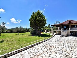 Spacious Beachfront Retreat With Large Garden in Ormos Panagias