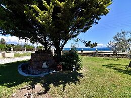 Spacious Beachfront Retreat With Large Garden in Ormos Panagias