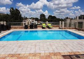 Magna Hotel and Suites