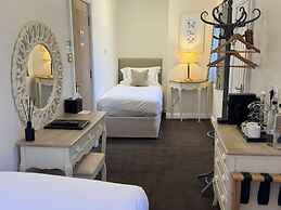 The Old Fourpenny Shop Hotel