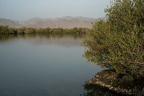 Kingfisher Retreat by Sharjah Collection