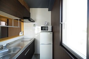 Mr. Kinjo inn D-buil