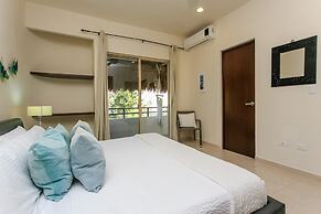 Condos Perfectly Situated Between the Beach & Tulum Town by Stella Ren