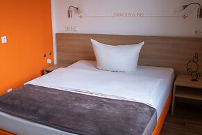 Orange Hotel und Apartments