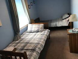 Petfriendly-beachfront-sunsetfacingsunporch-garden