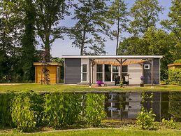 Sunlit Chalet by the Pond