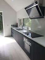 Red Stag With Stunning Loch and Waterfall View