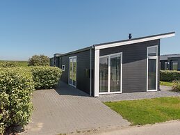 Nice Chalet with Fireplace near Oosterschelde