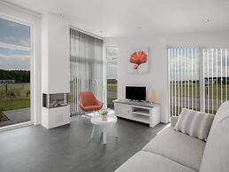 Nice Chalet with Fireplace near Oosterschelde