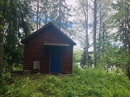 Tiny hut in the Forest Overlooking the River