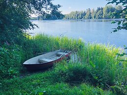 Tiny hut in the Forest Overlooking the River