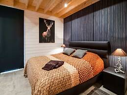 Idyllic Chalet in Biron with 2 Hot Tubs & Sauna
