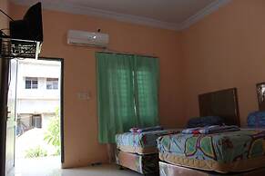 Penginapan Transit Tomato
