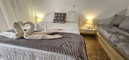 Santorini Studios Pleasure By The Sea