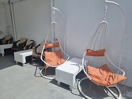Santorini Studios Pleasure By The Sea