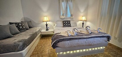 Santorini Studios Pleasure By The Sea