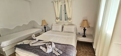 Santorini Studios Pleasure By The Sea