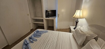 Santorini Studios Pleasure By The Sea